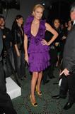 Charlize Theron in very low-cut purple dress shows cleavage at Christian Dior Cruise 2009 Collection