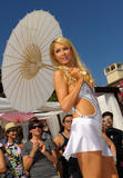 Paris Hilton in skimpy outfit show of her body as she poses as she launch The Bandit, the first interchangeable hair extension headband in Malibu,